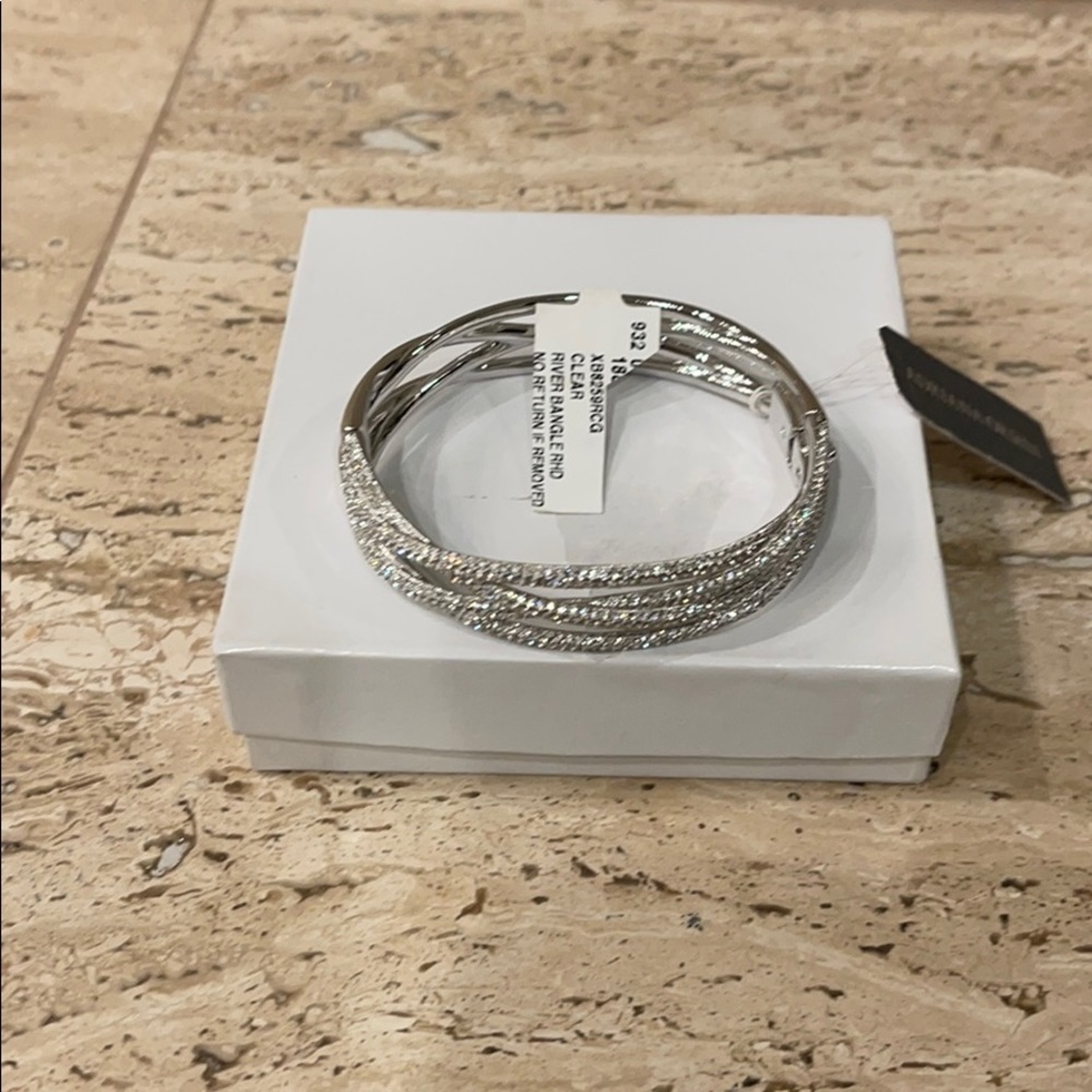 Crystal bangle; clasp closure. Silver.